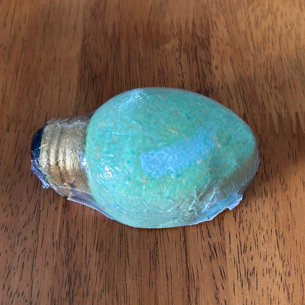 Bath bomb. Christmas bulb design with Christmas cookie smell. Lights up